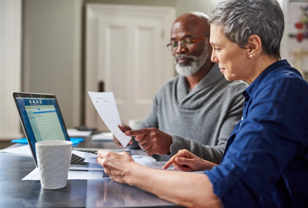 A couple reviewing the retirement plan contribution limits